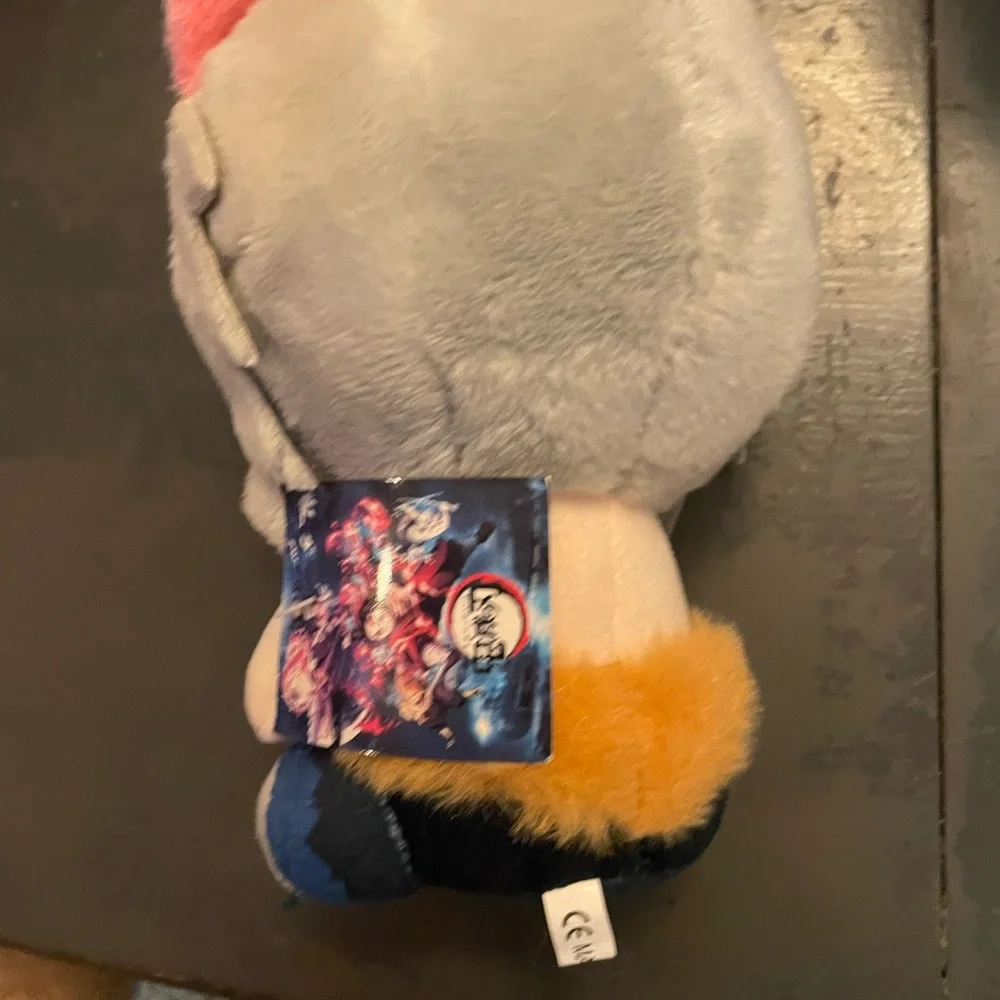 Gray and Pink Plush Toy with Blue Eyes